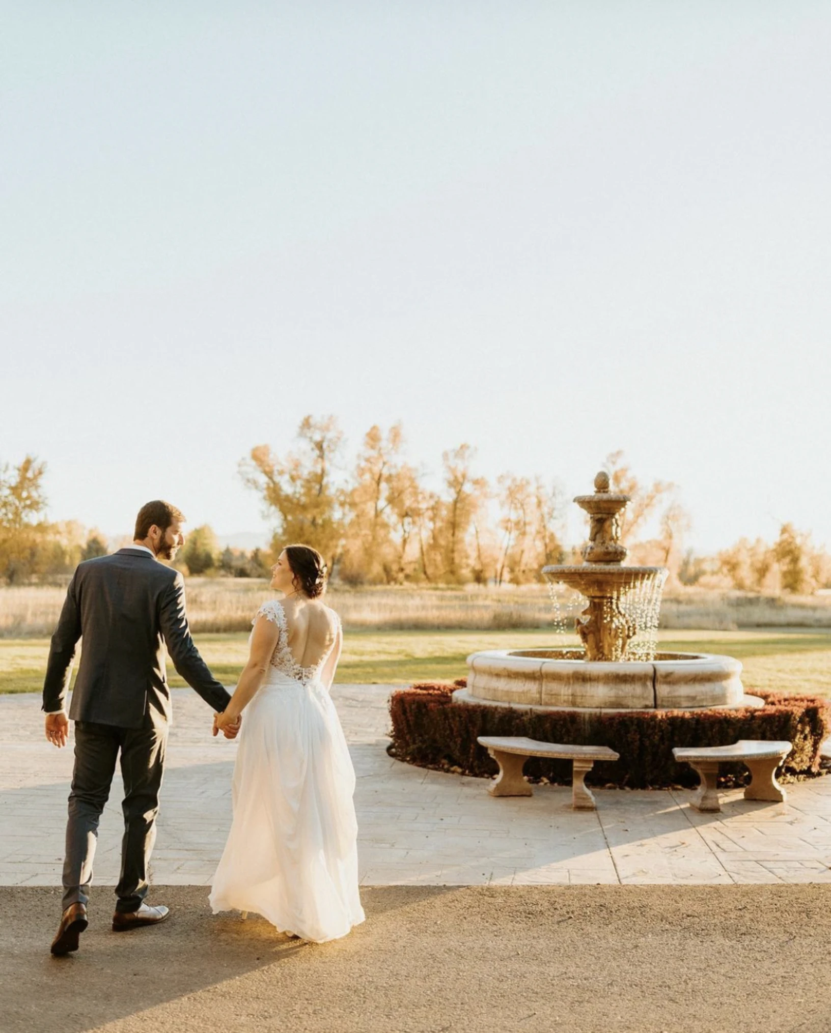 Couple walking near fountain at Chateau Event Center